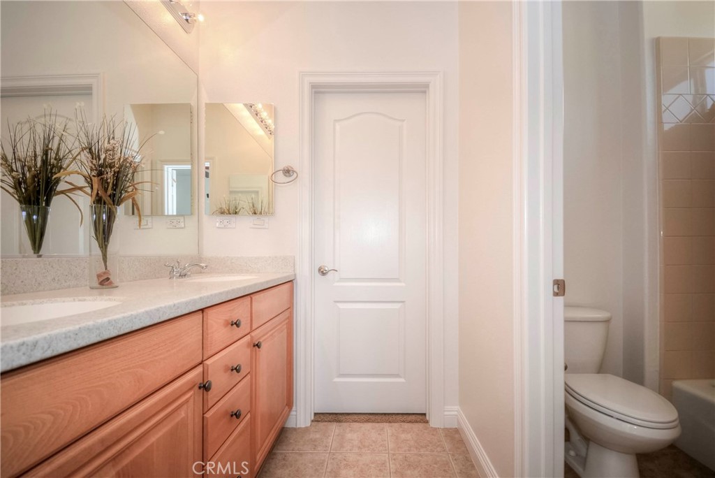 1803 Glen Rosa Street Upland, CA 91784 - Photo 51 of 68 a bathroom with a granite countertop sink toilet and shower