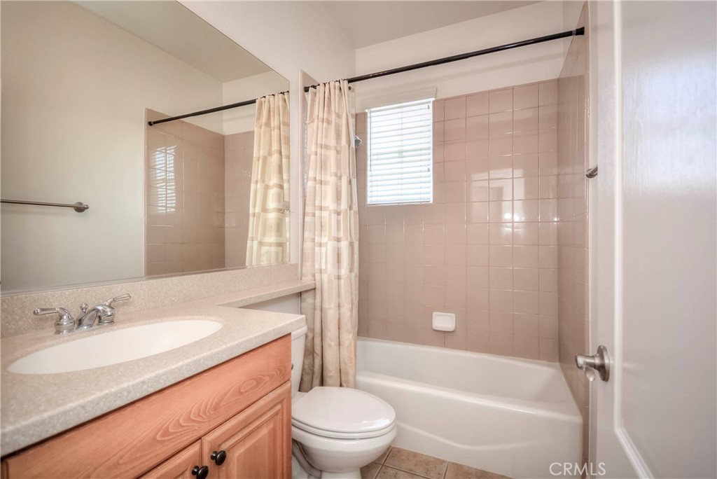 1803 Glen Rosa Street Upland, CA 91784 - Photo 56 of 68 a bathroom with a granite countertop sink toilet and shower