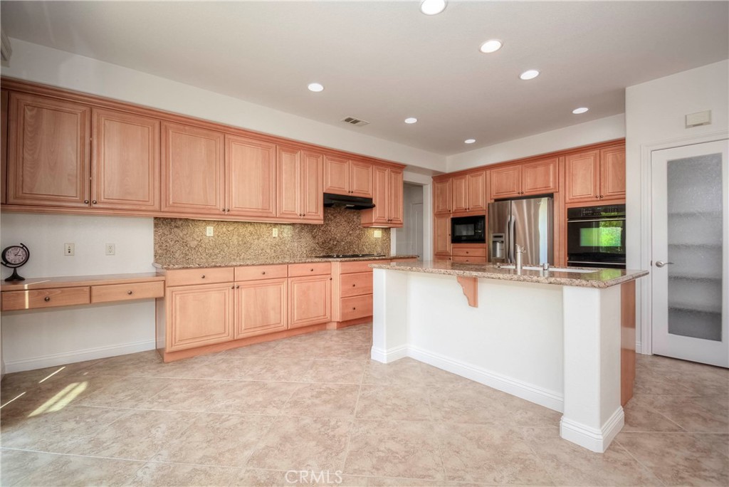 1803 Glen Rosa Street Upland, CA 91784 - Photo 6 of 68 a kitchen with stainless steel appliances granite countertop a refrigerator sink and cabinets