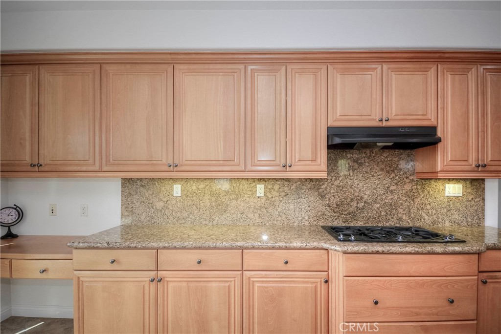 1803 Glen Rosa Street Upland, CA 91784 - Photo 7 of 68 a kitchen with granite countertop white cabinets and sink