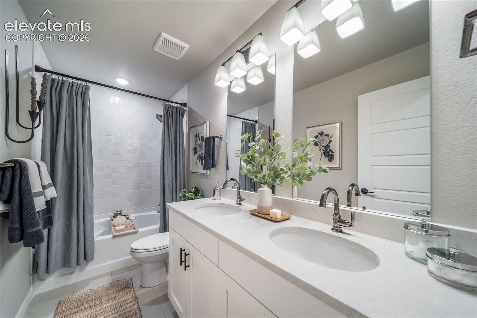 4876 Truscott Road Colorado Springs, CO 80925 - Photo 2 of 28 Dual vanity with integrated sinks and chrome fixtures
*Photos of a model home*