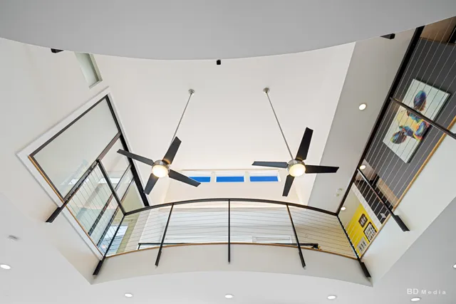 a kitchen with granite countertop stainless steel appliances a stove and a microwave