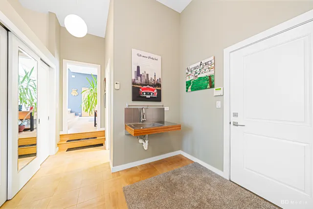 a view of staircase with a floor to ceiling window and wooden floor
