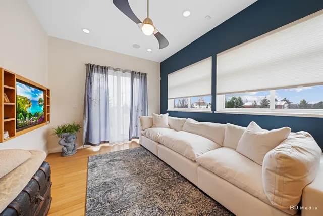 a bedroom with a bed and a book shelf