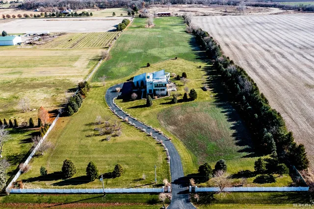 a view of a swimming pool with a yard