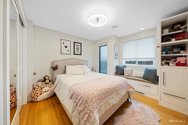 a spacious bathroom with a sink double vanity and a mirror