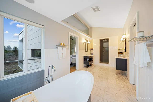 a kitchen with stainless steel appliances kitchen island a refrigerator and a stove top oven