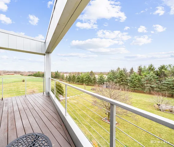 a view of a lake with outdoor seating