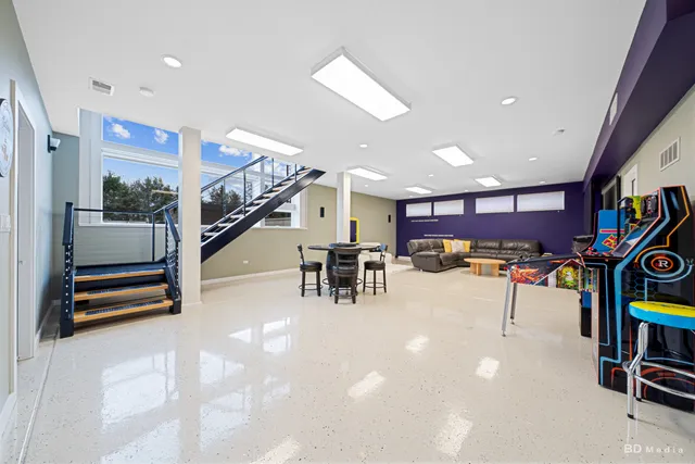 a view of swimming pool with outdoor seating and plants