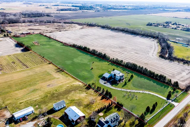 an aerial view of a house with a garden