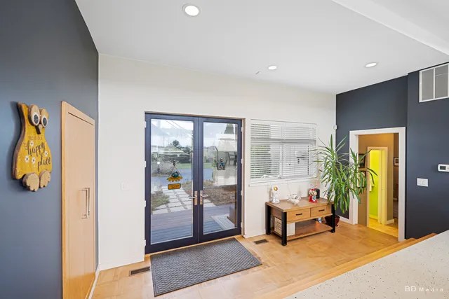 a kitchen with stainless steel appliances granite countertop a refrigerator a sink and a stove