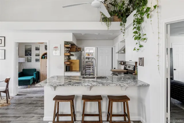 a kitchen with kitchen island granite countertop lots of counter top space and furniture
