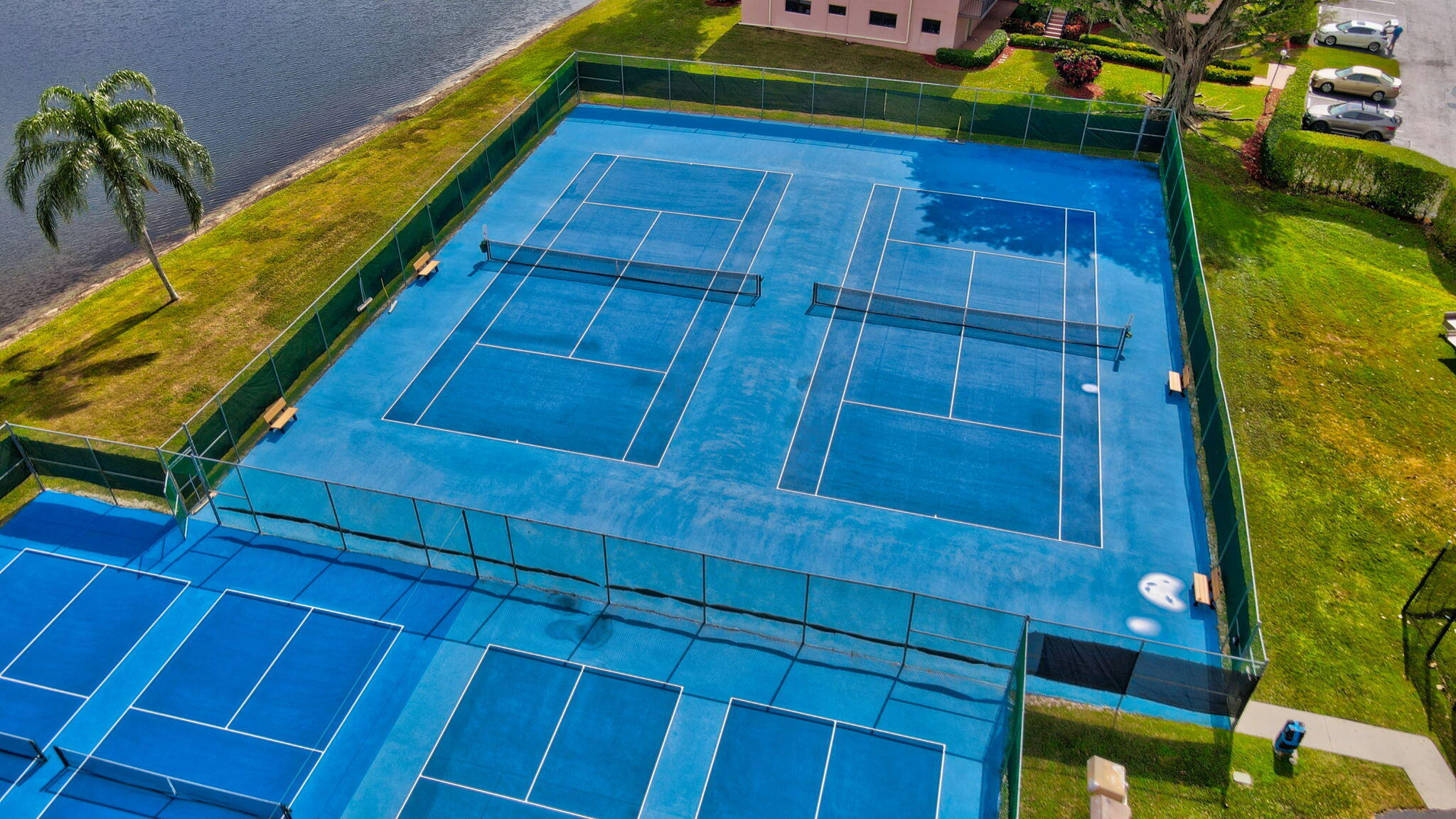 5574 Witney Drive, Unit 109 Delray Beach, FL 33484 - Photo 107 of 114 a view of a backyard with plants and a patio