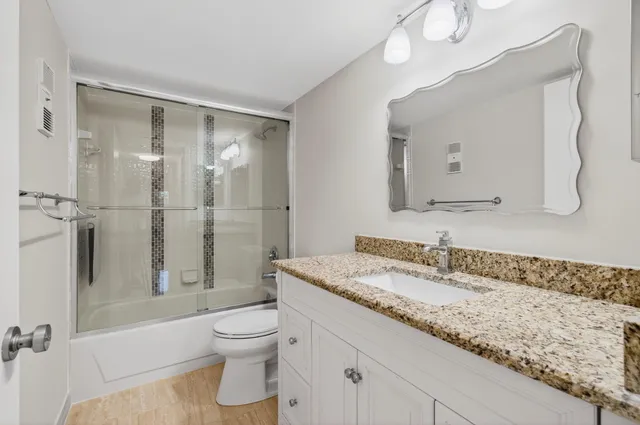 a living room with furniture and white walls