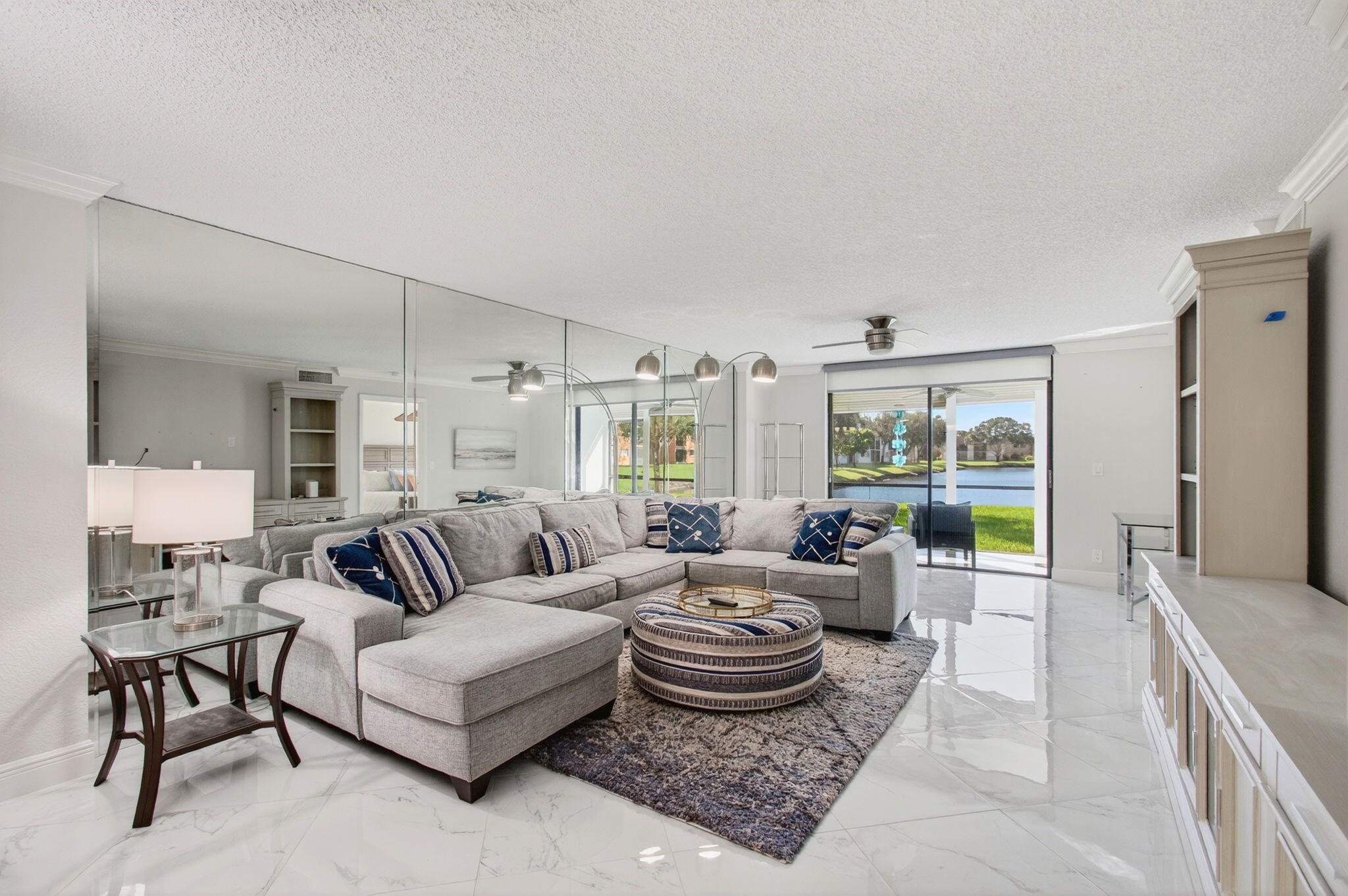 5574 Witney Drive, Unit 109 Delray Beach, FL 33484 - Photo 34 of 114 a living room with furniture and a large window