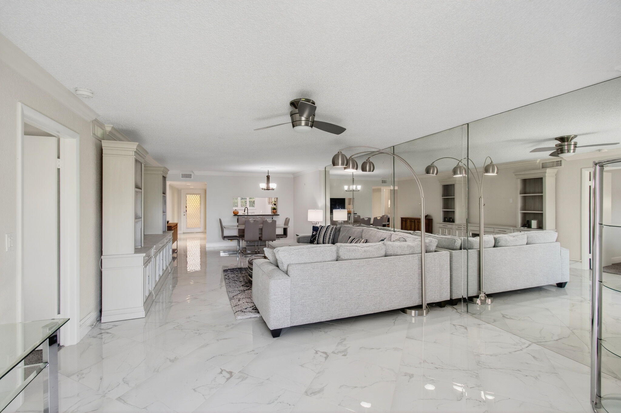 5574 Witney Drive, Unit 109 Delray Beach, FL 33484 - Photo 36 of 114 a living room with furniture and white walls