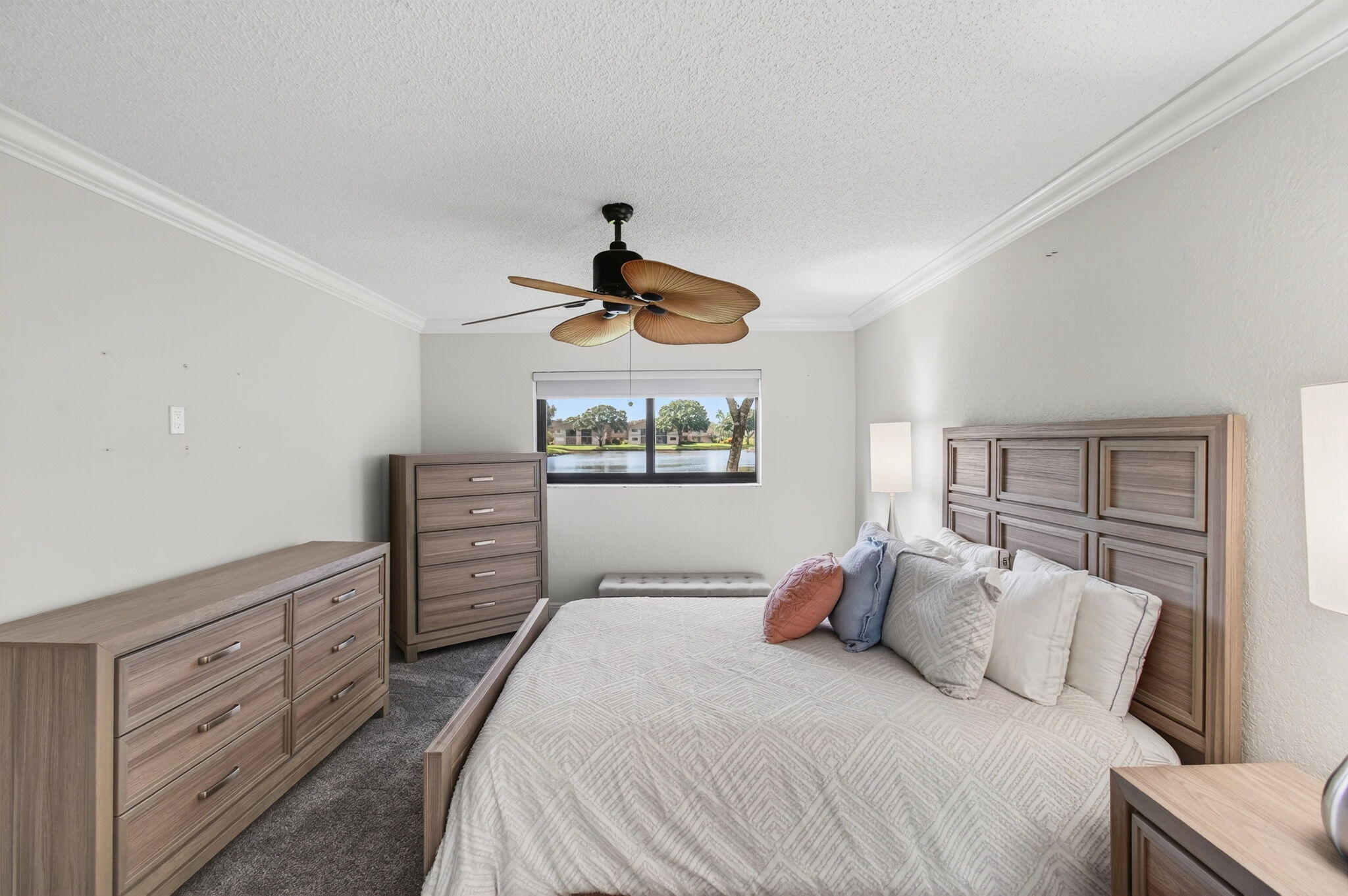 5574 Witney Drive, Unit 109 Delray Beach, FL 33484 - Photo 52 of 114 a bedroom with a bed and a painting on the wall