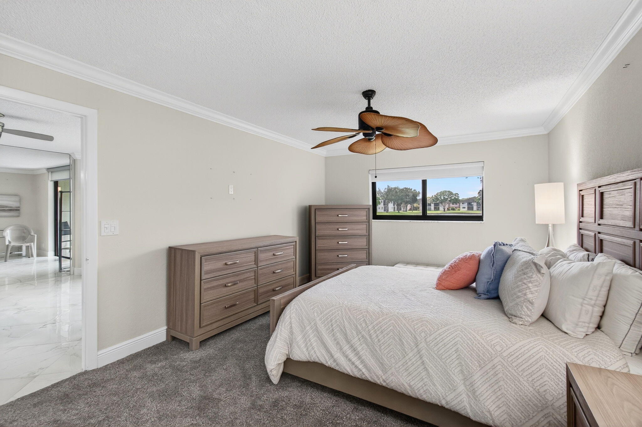 5574 Witney Drive, Unit 109 Delray Beach, FL 33484 - Photo 56 of 114 a bedroom with a bed and dresser