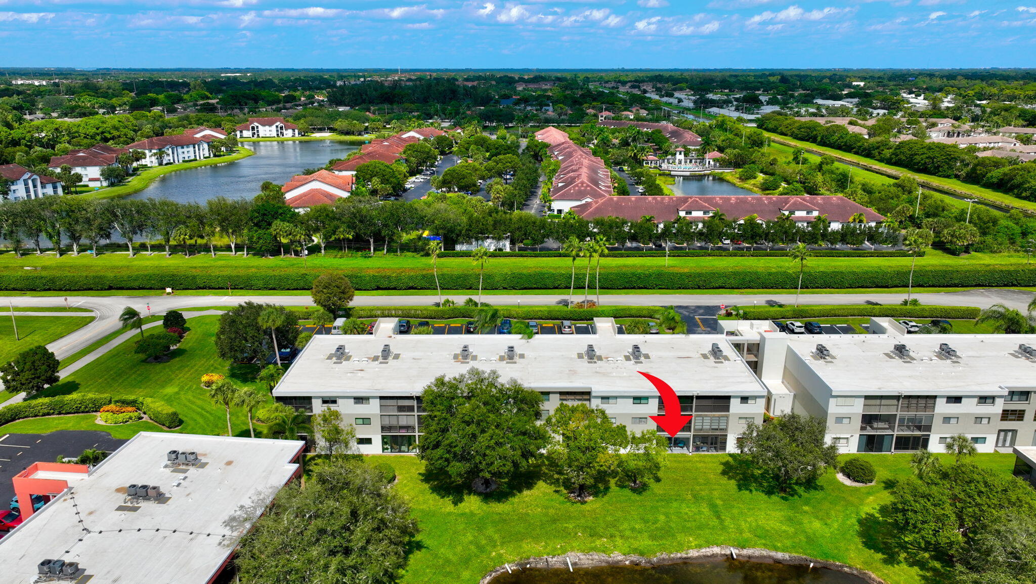 5574 Witney Drive, Unit 109 Delray Beach, FL 33484 - Photo 71 of 114 a view of a house with a yard and pool