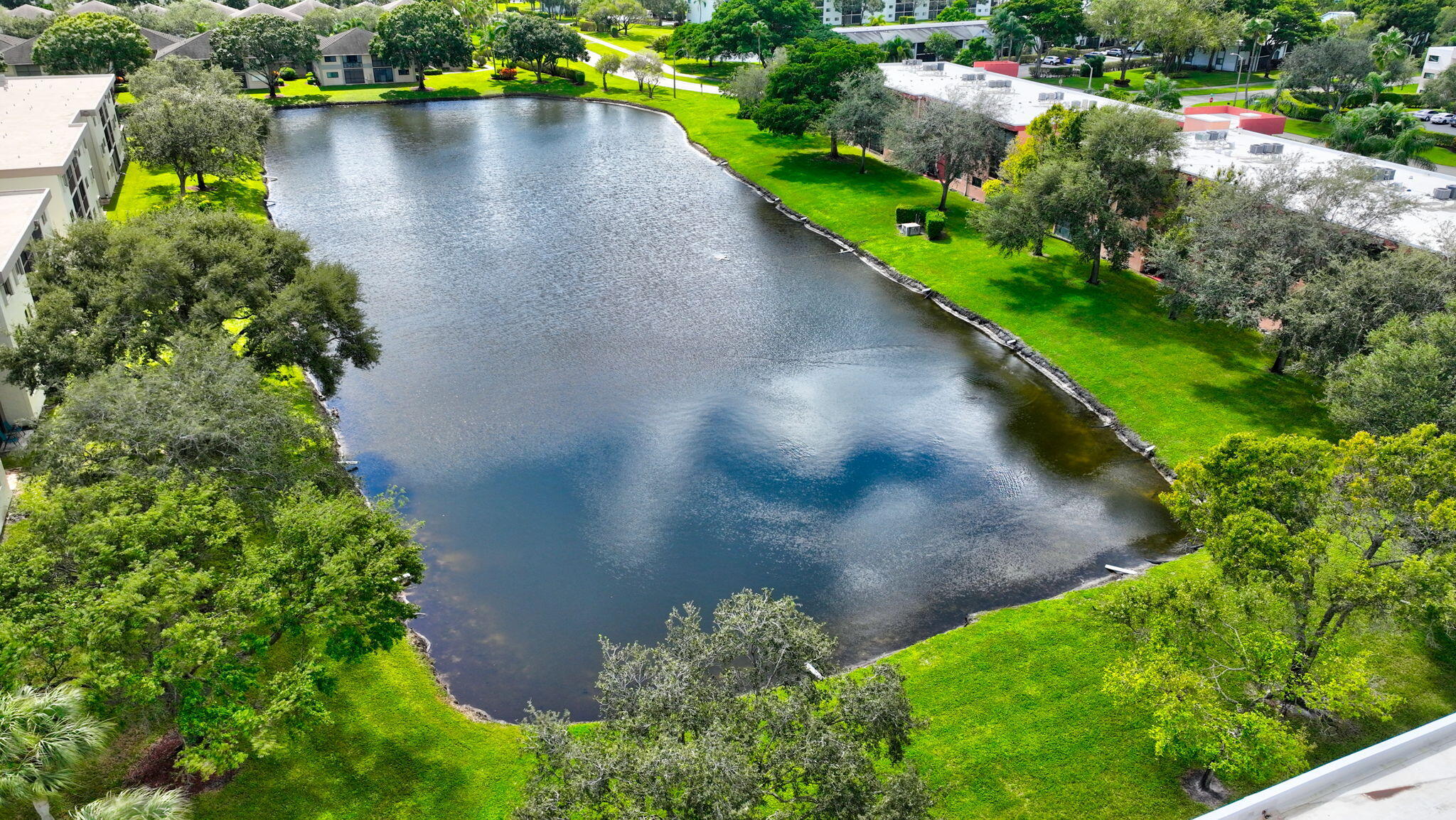 5574 Witney Drive, Unit 109 Delray Beach, FL 33484 - Photo 77 of 114 a view of a garden with a lake