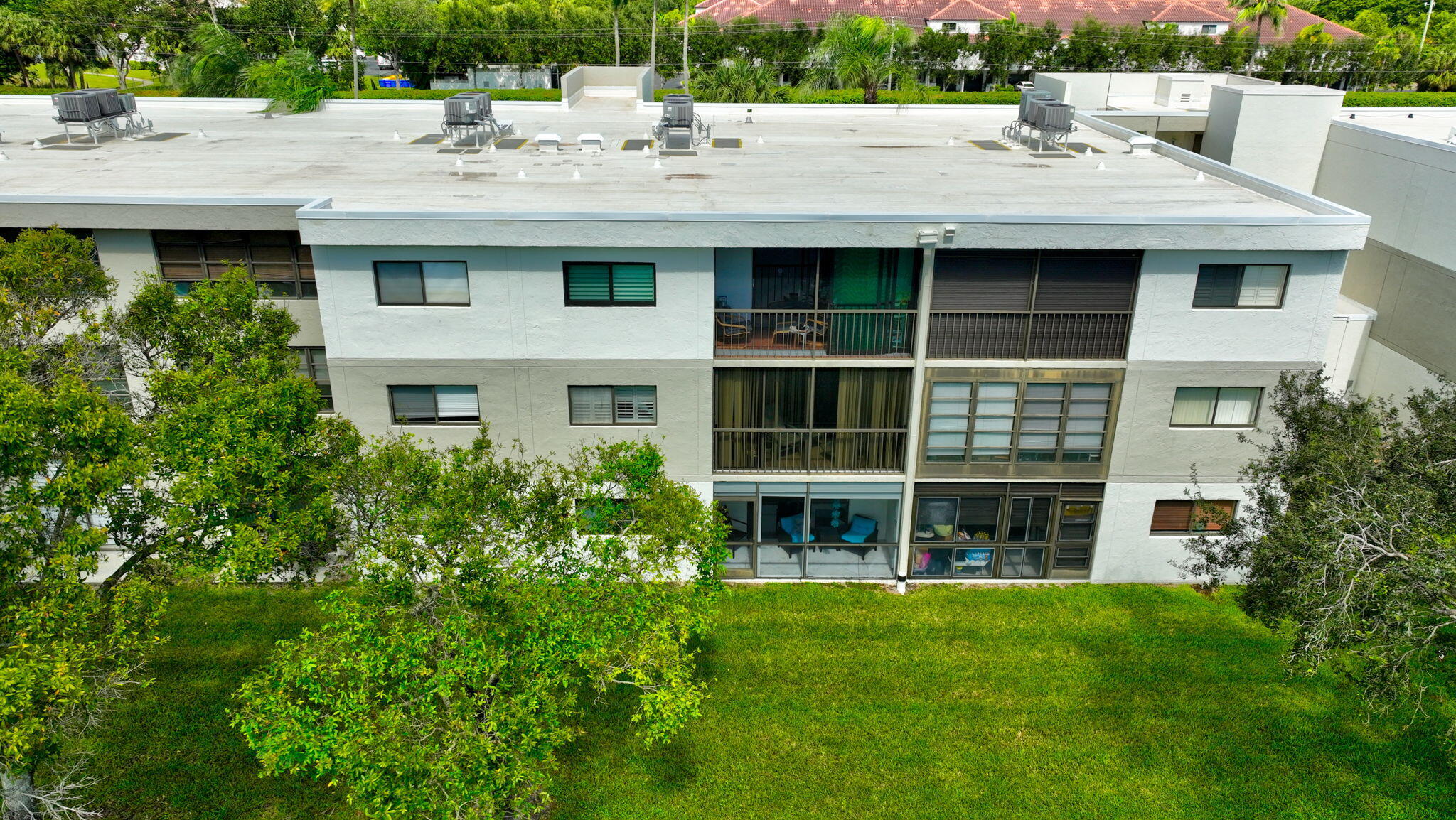 5574 Witney Drive, Unit 109 Delray Beach, FL 33484 - Photo 80 of 114 a view of a house with a yard and sitting space