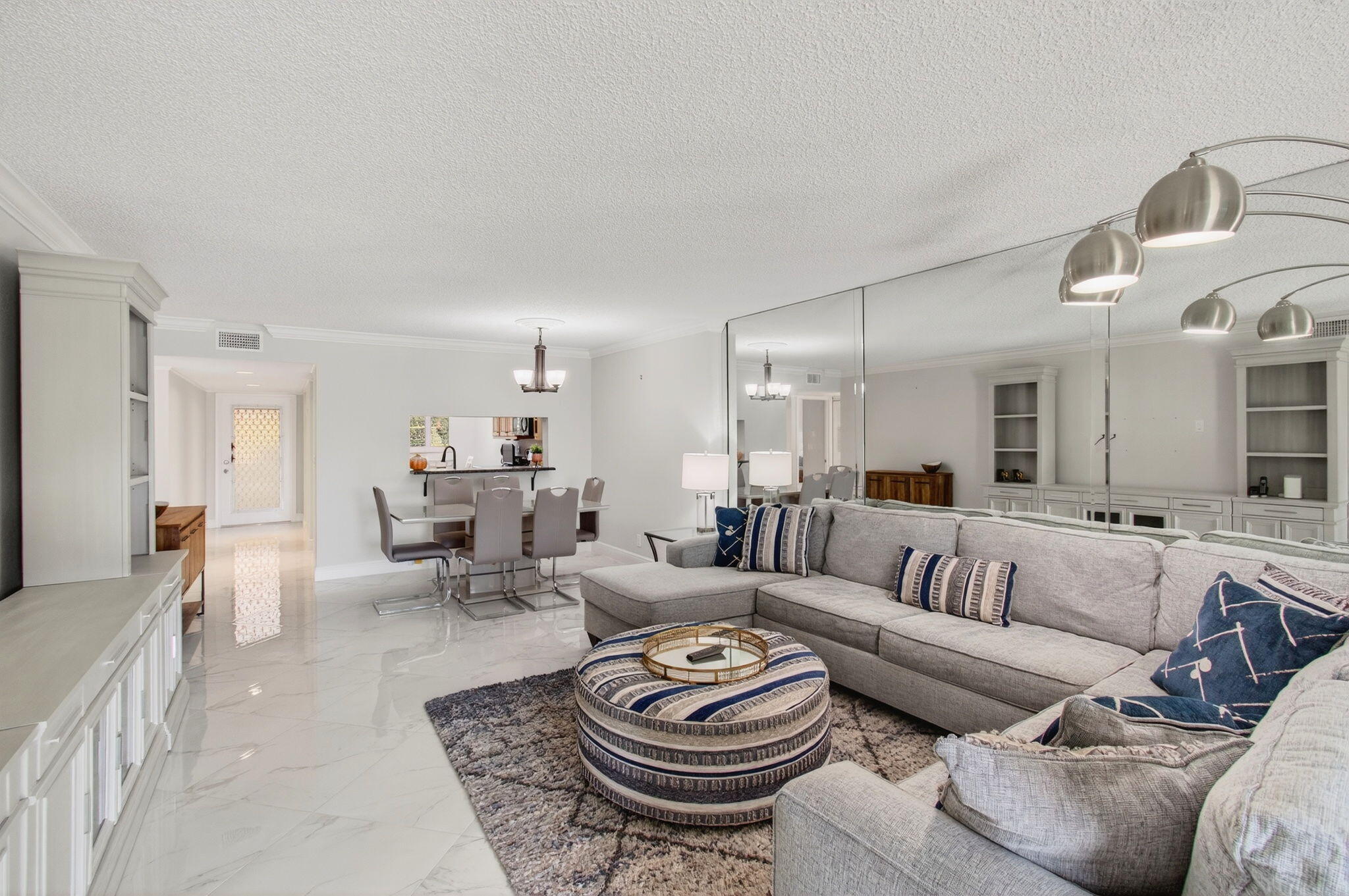 5574 Witney Drive, Unit 109 Delray Beach, FL 33484 - Photo 10 of 114 a living room with furniture and a wooden floor