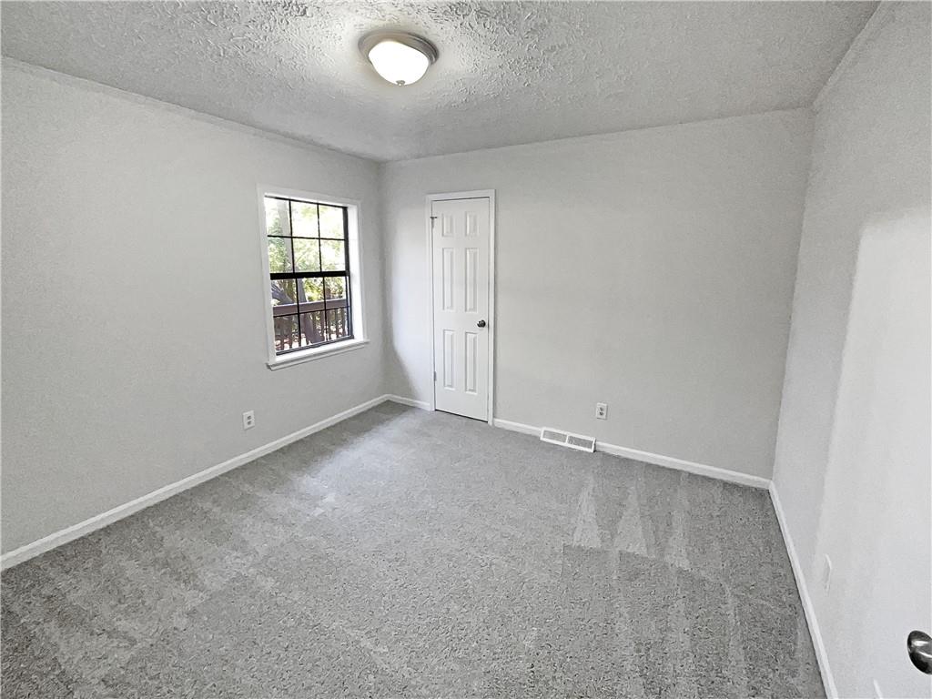 4425 Amy Road Snellville, GA 30039 - Photo 11 of 19 an empty room with windows