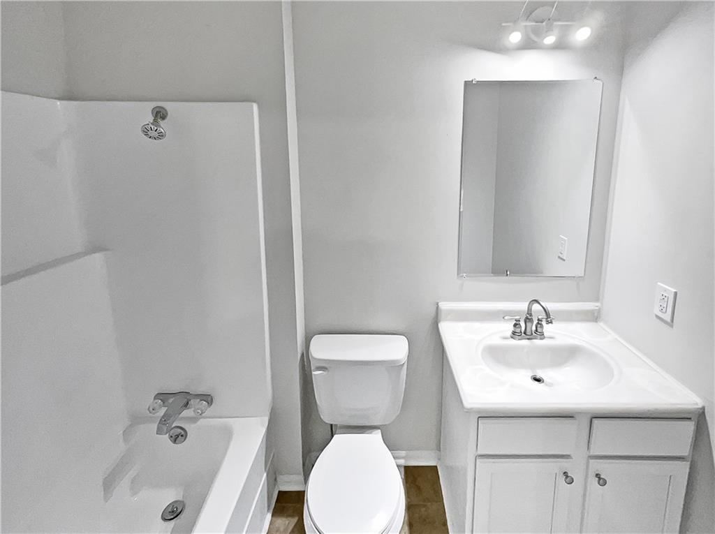 4425 Amy Road Snellville, GA 30039 - Photo 16 of 19 a bathroom with a sink a toilet and shower