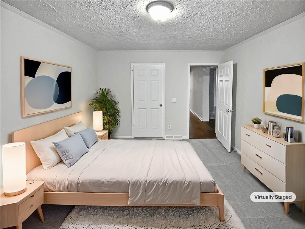 4425 Amy Road Snellville, GA 30039 - Photo 9 of 19 a spacious bedroom with a bed and a dresser