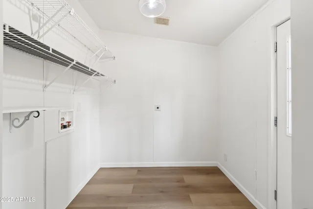 a view of a house with a yard and tree