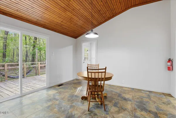 a view of kitchen and dining room with furniture
