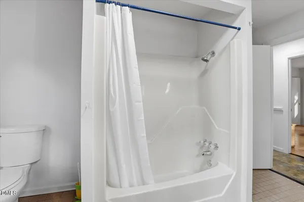 a spacious bathroom with double vanity and a two mirror