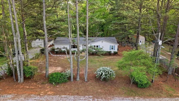 an aerial view of a house with a garden