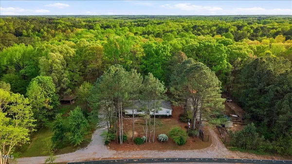 a view of large house with yard and tree s