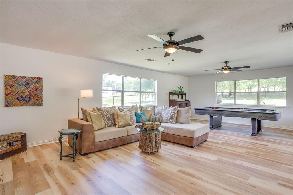 6345 Silver Creek Azle Road Azle, TX 76020 - Photo 11 of 40 a living room with furniture and a large window