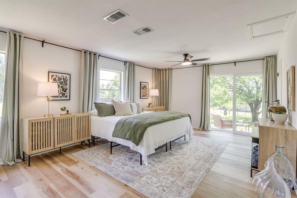 6345 Silver Creek Azle Road Azle, TX 76020 - Photo 21 of 40 a spacious bedroom with a bed and a large window