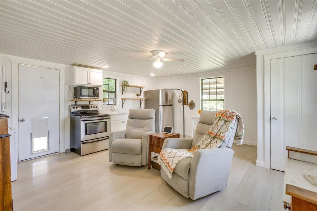 6345 Silver Creek Azle Road Azle, TX 76020 - Photo 31 of 40 a living room with furniture and kitchen view