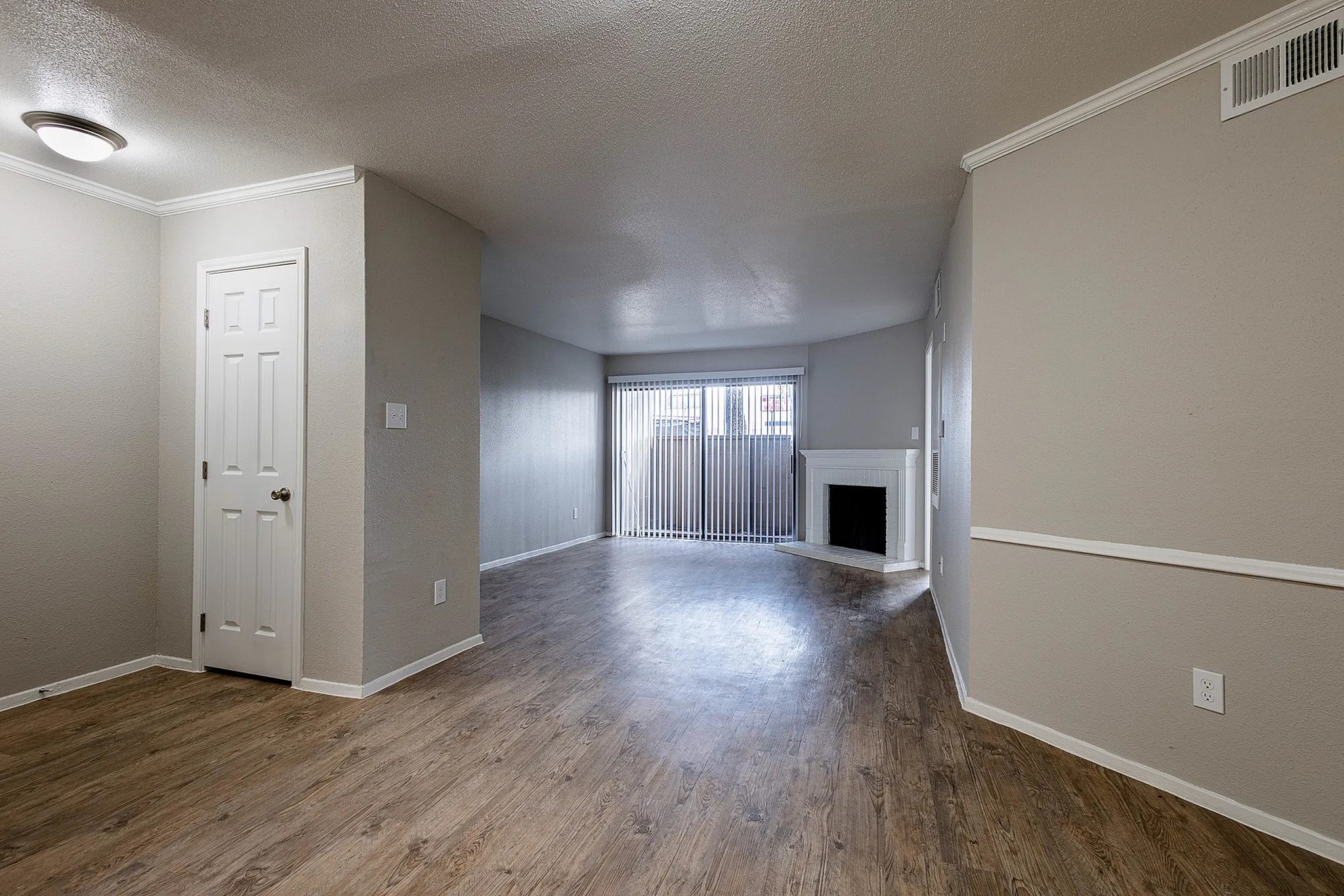 1230 Farm To Market 1960 Bypass Road East, Unit 312 Humble, TX 77338 - Photo 12 of 20 an empty room with wooden floor and windows