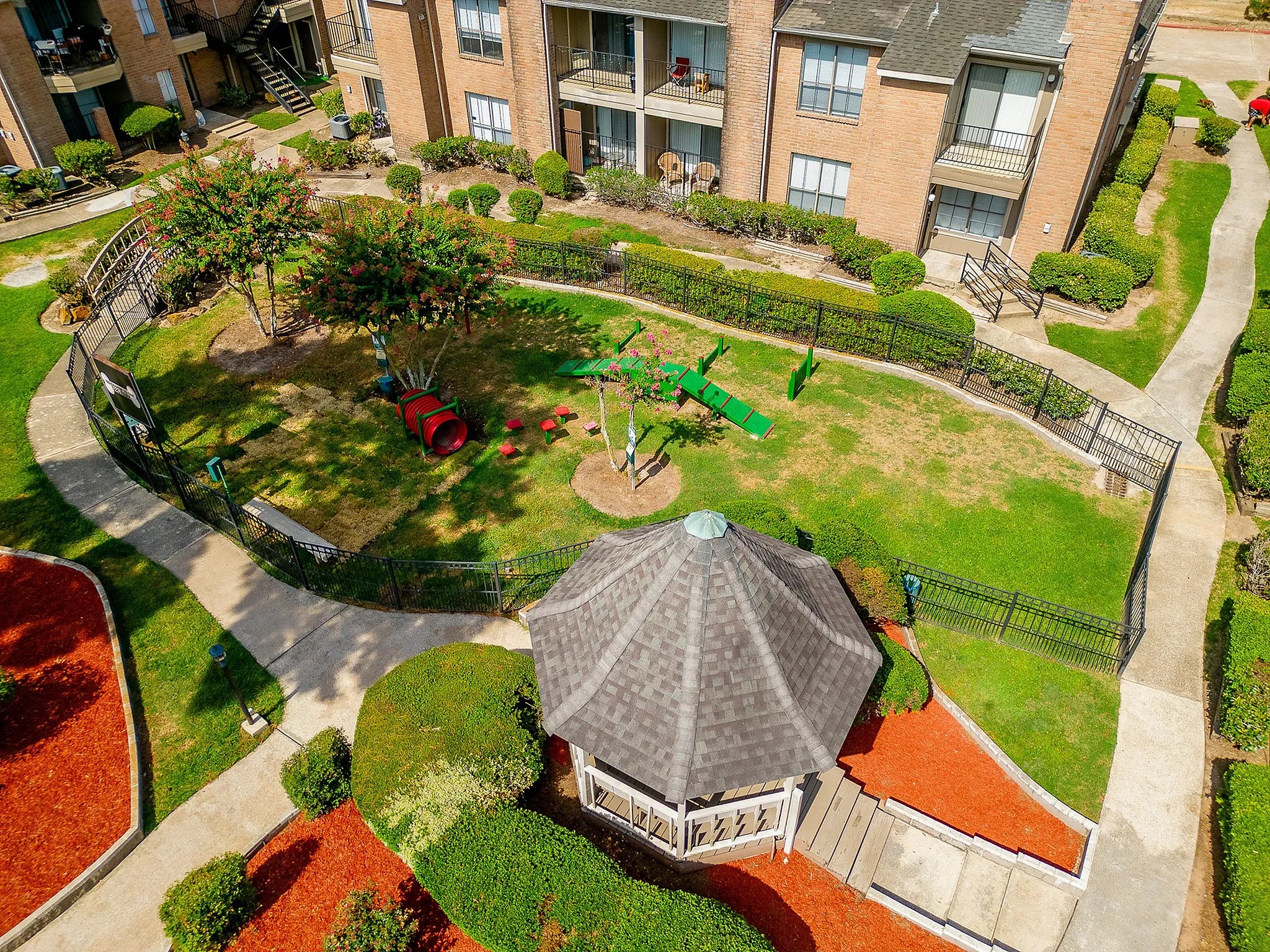 1230 Farm To Market 1960 Bypass Road East, Unit 312 Humble, TX 77338 - Photo 9 of 20 an aerial view of a house with a yard and potted plants