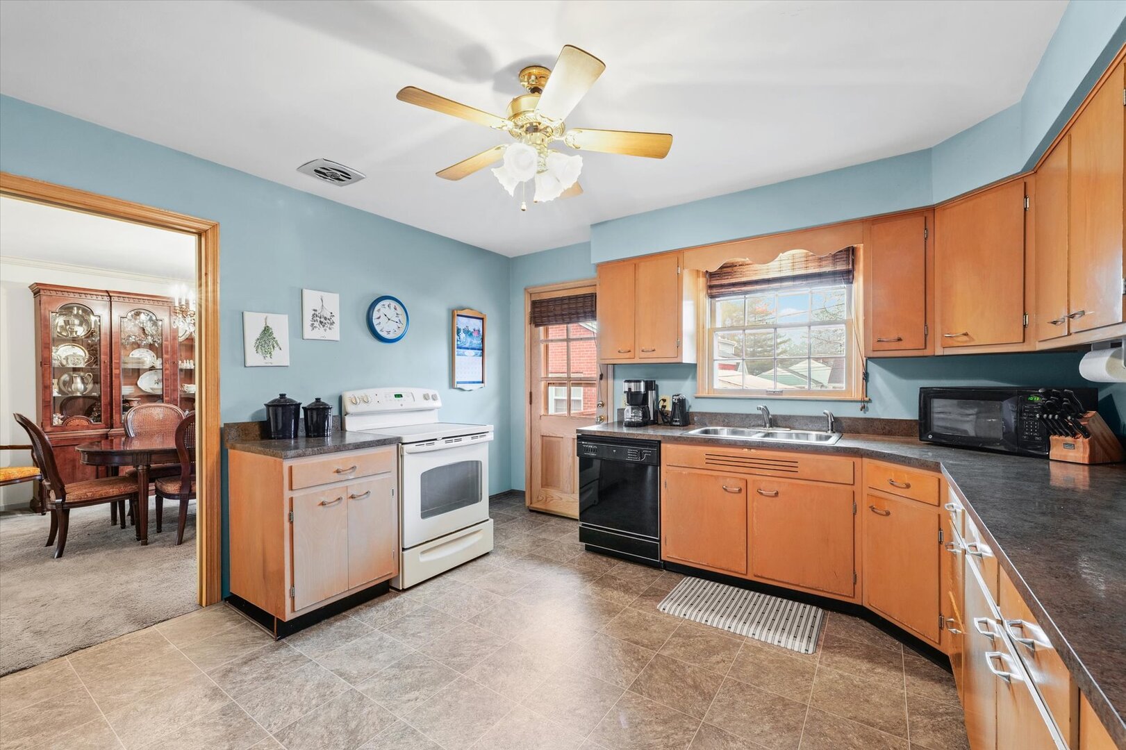 901 West Healey Street Champaign, IL 61821 - Photo 11 of 30 a large white kitchen with cabinets a sink and appliances