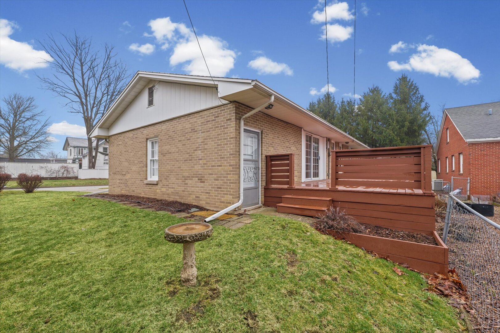 901 West Healey Street Champaign, IL 61821 - Photo 28 of 30 a backyard of a house with a garden and outdoor seating