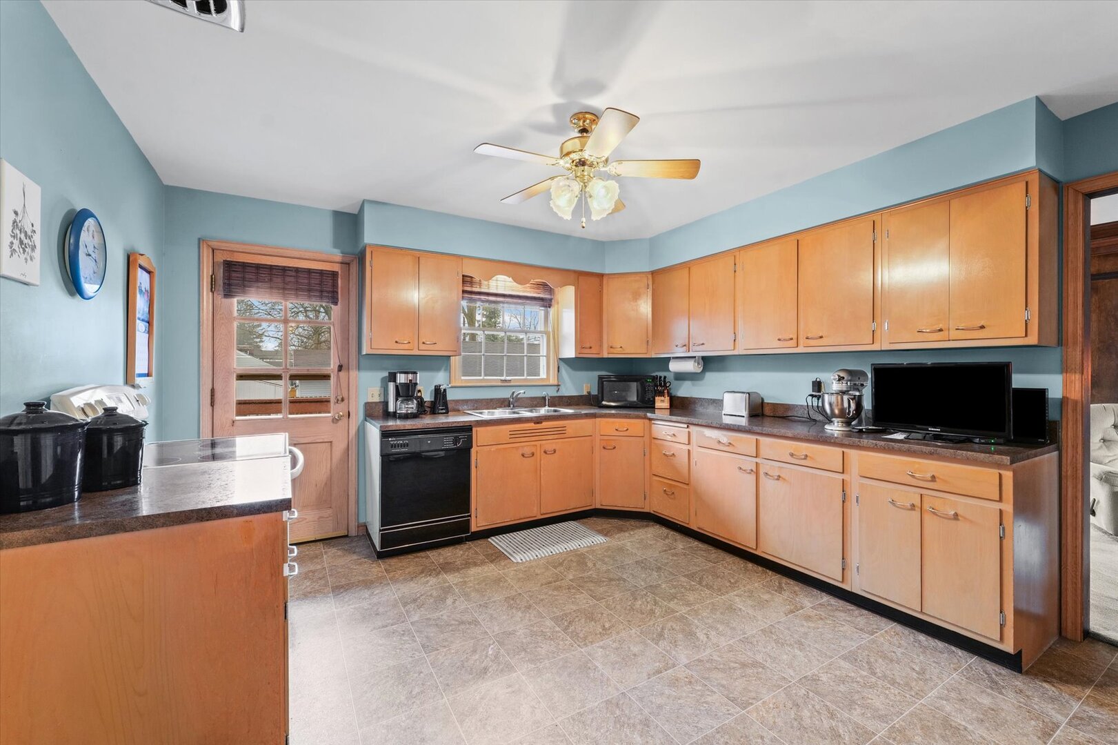 901 West Healey Street Champaign, IL 61821 - Photo 10 of 30 a large kitchen with stainless steel appliances granite countertop a stove cabinets and a kitchen view