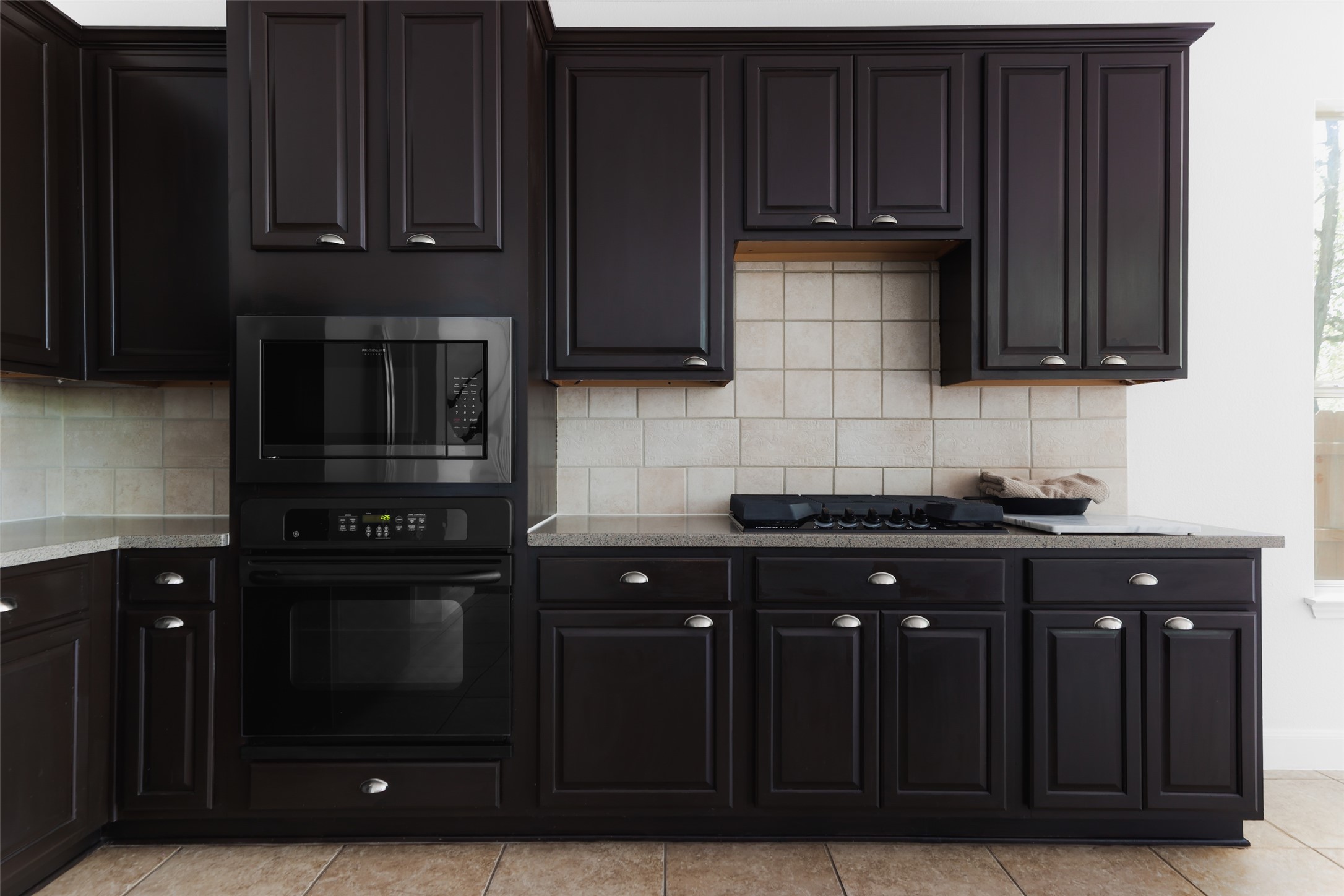 7921 Davis Mountain Pass Austin, TX 78726 - Photo 14 of 40 a kitchen with a sink and cabinets