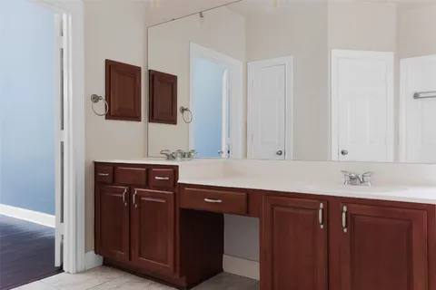 a bathroom with a sink and mirror