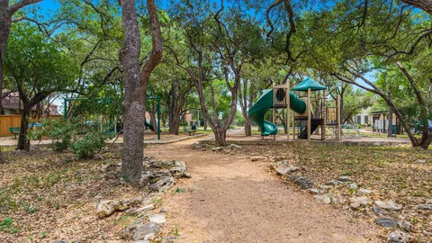 a view of a tree in front of a house