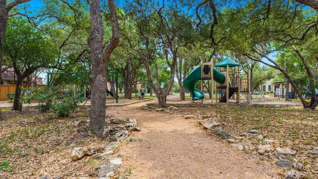 a view of a tree in front of a house