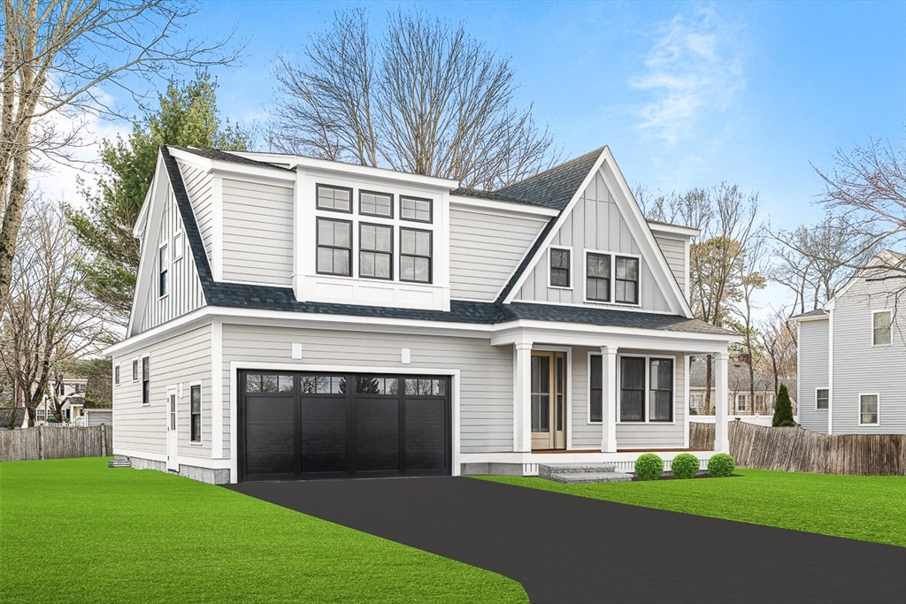 a front view of a house with a yard and trees