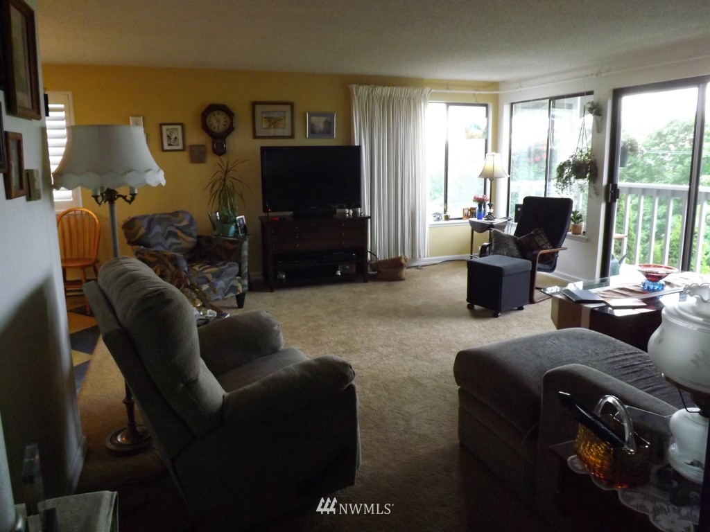 630 Boulevard Bellingham, WA 98225 - Photo 12 of 13 a living room with furniture a large window and a flat screen tv