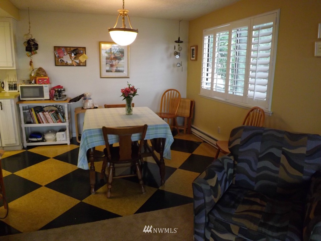 630 Boulevard Bellingham, WA 98225 - Photo 7 of 13 a dining room with furniture and a chandelier