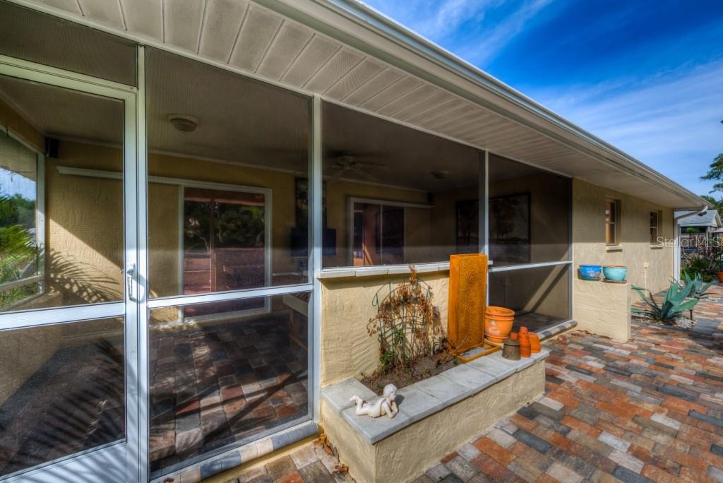 1453 Nantucket Road Venice, FL 34293 - Photo 26 of 35 The rear covered and screened lanai measures 10x21 and includes a ceiling fan and tv with speakers.